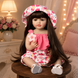 Ігрова лялька у стилі Reborn Baby Doll Milana 55 см &ndash; вінілова дівчинка з довгим темним волоссям та аксесуарами; підходить для купання (RB096) RB096 фото 4