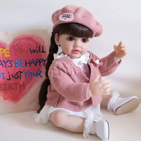 Ігрова лялька у стилі Reborn Baby Doll Mila 55 см, вінілова дівчинка у рожевому образі з беретом, з волоссям, можна купати (RB053) RB053 фото