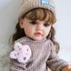 Ігрова лялька у стилі Reborn Liora Cozy 55 см &mdash; вінілова дівчинка з волоссям та аксесуарами, можна купати (RB054) RB054 фото 1
